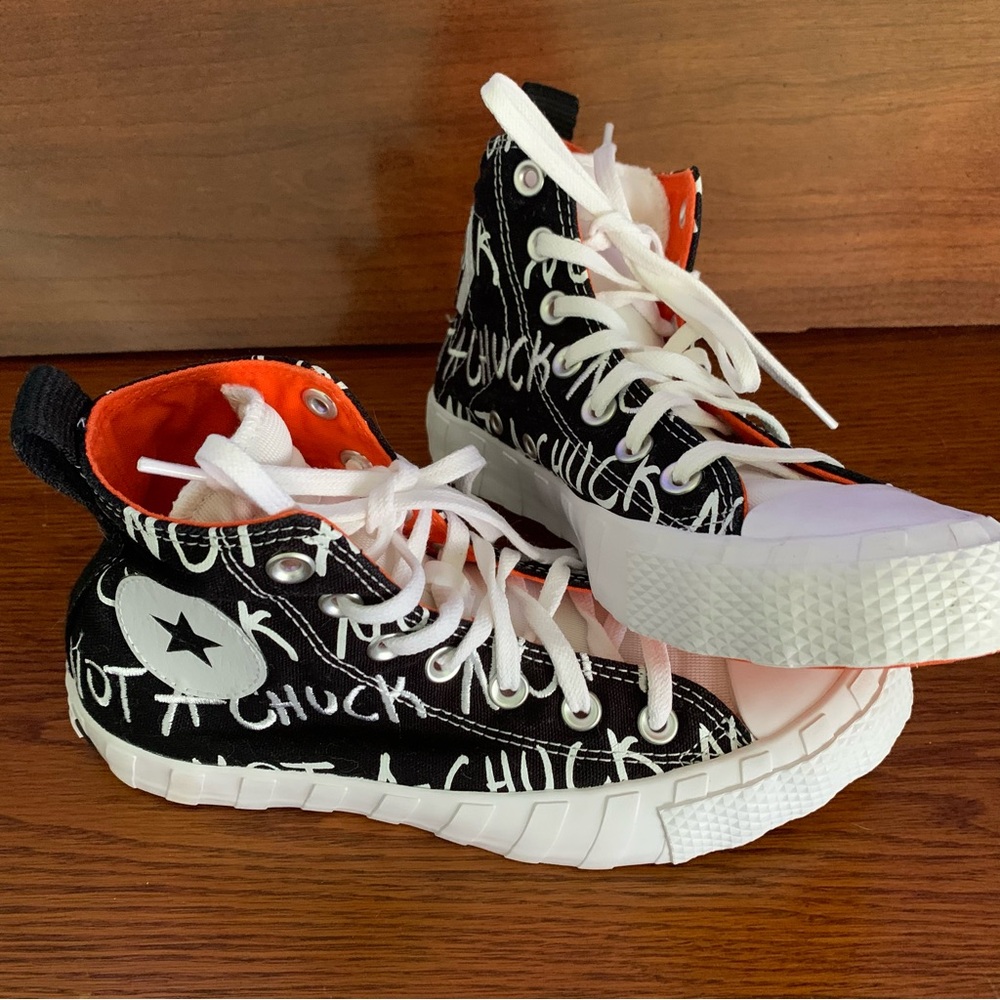 Converse Black and White High-Tops with Orange Lining